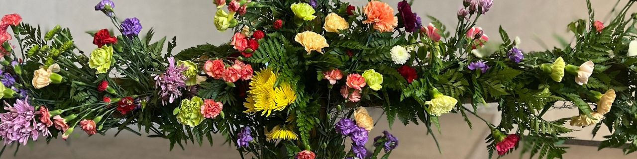 Close up of the cross covered with flowers from Easter Sunday 2025